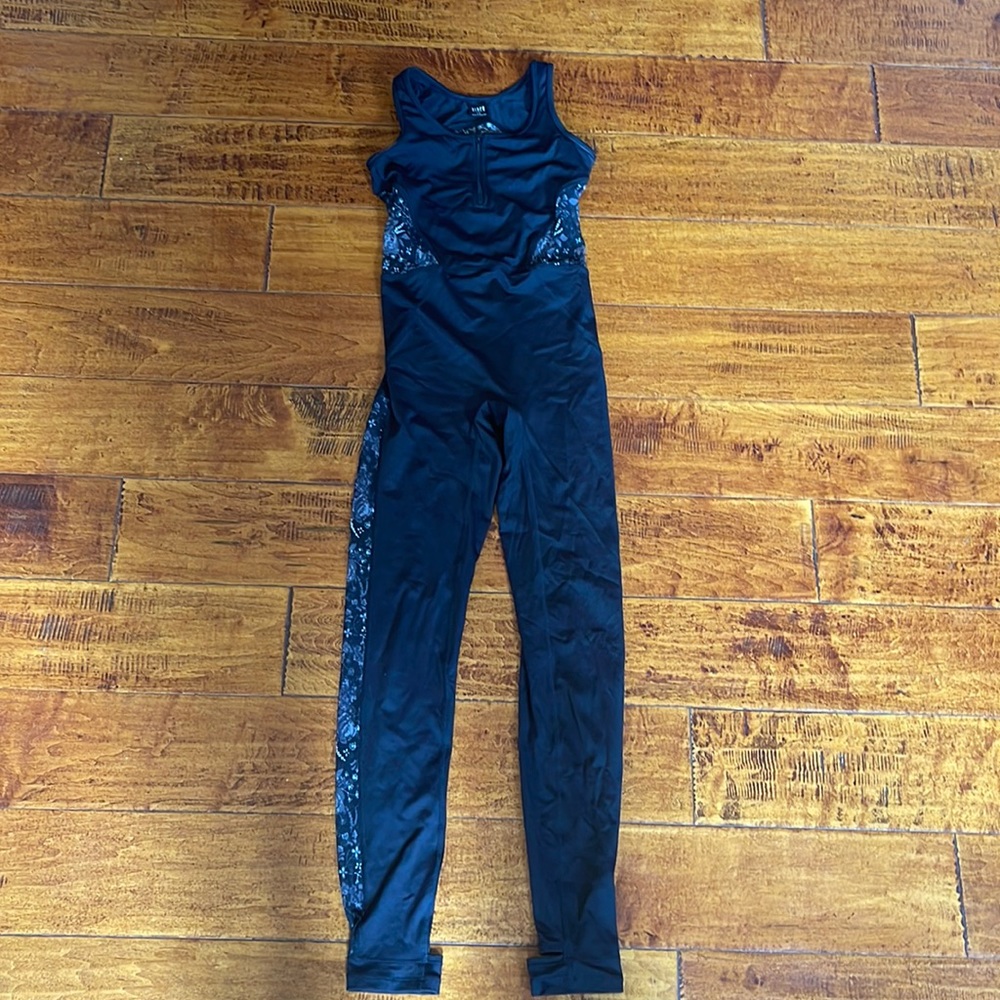 Bloch size 12 dance romper with heel straps. Floral mesh areas are see through